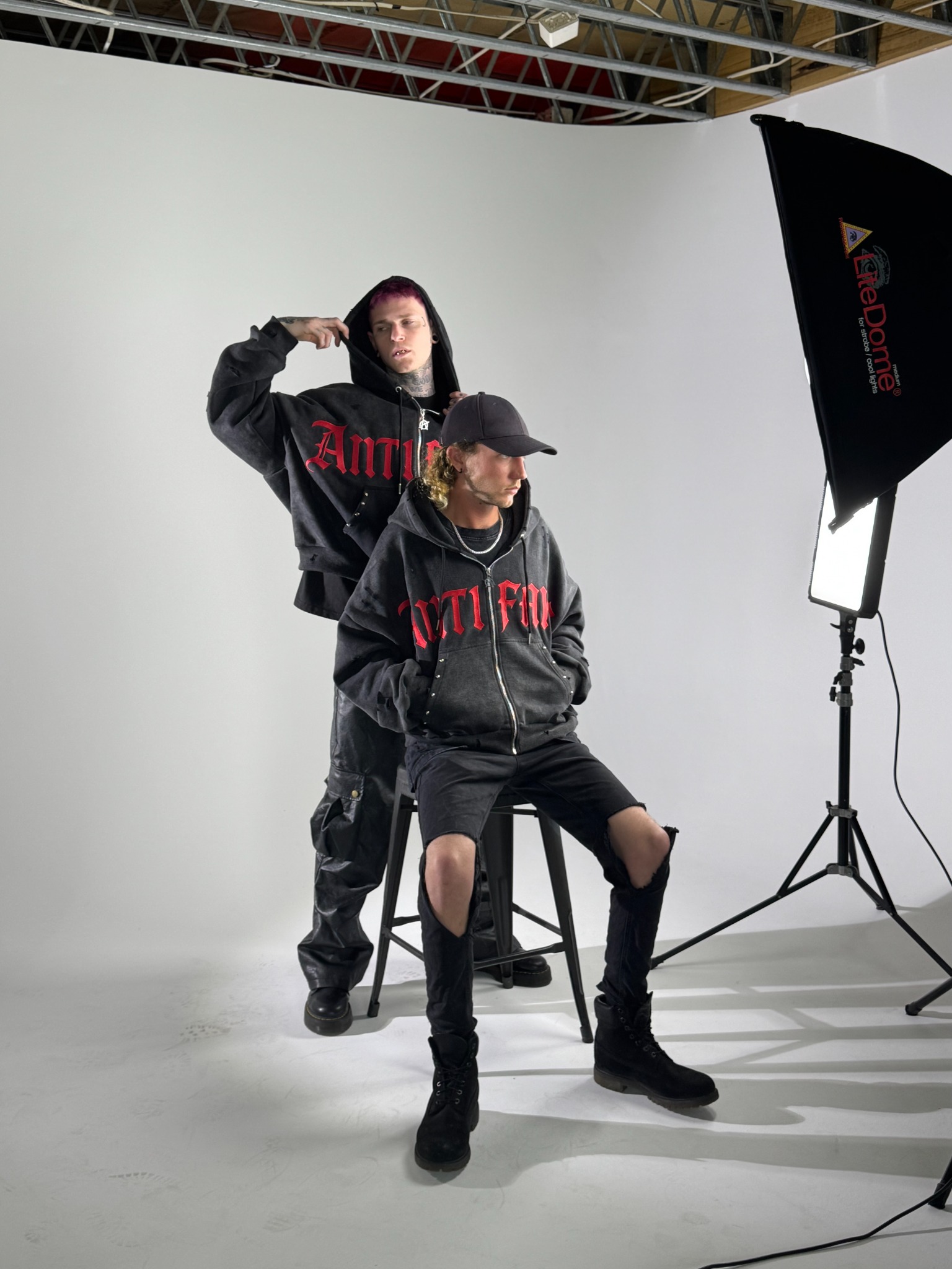 Portrait-style shot of models under studio lighting