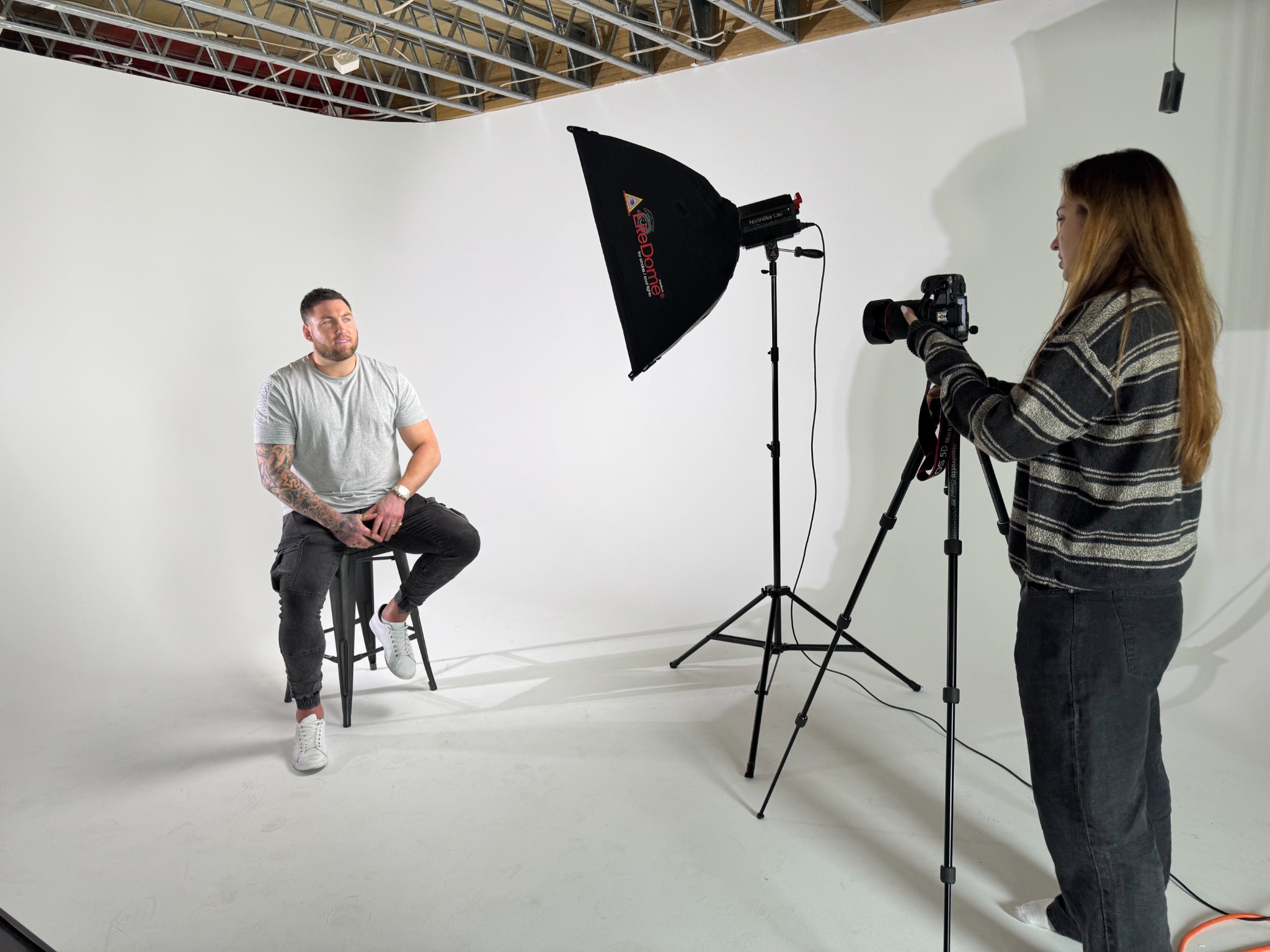 Clean portrait setup with lighting and camera in studio